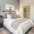 a bedroom with a bed and dresser