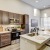a kitchen with an island and chairs